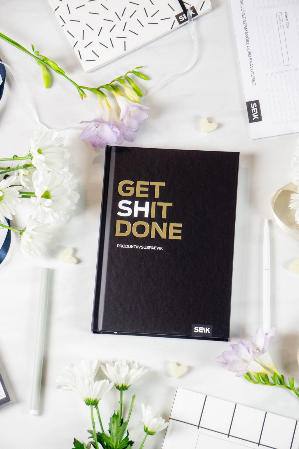 9. Get (sh)it done #Produktiivsuspäevik planner cover by SEIK, black with gold text, styled with flowers
