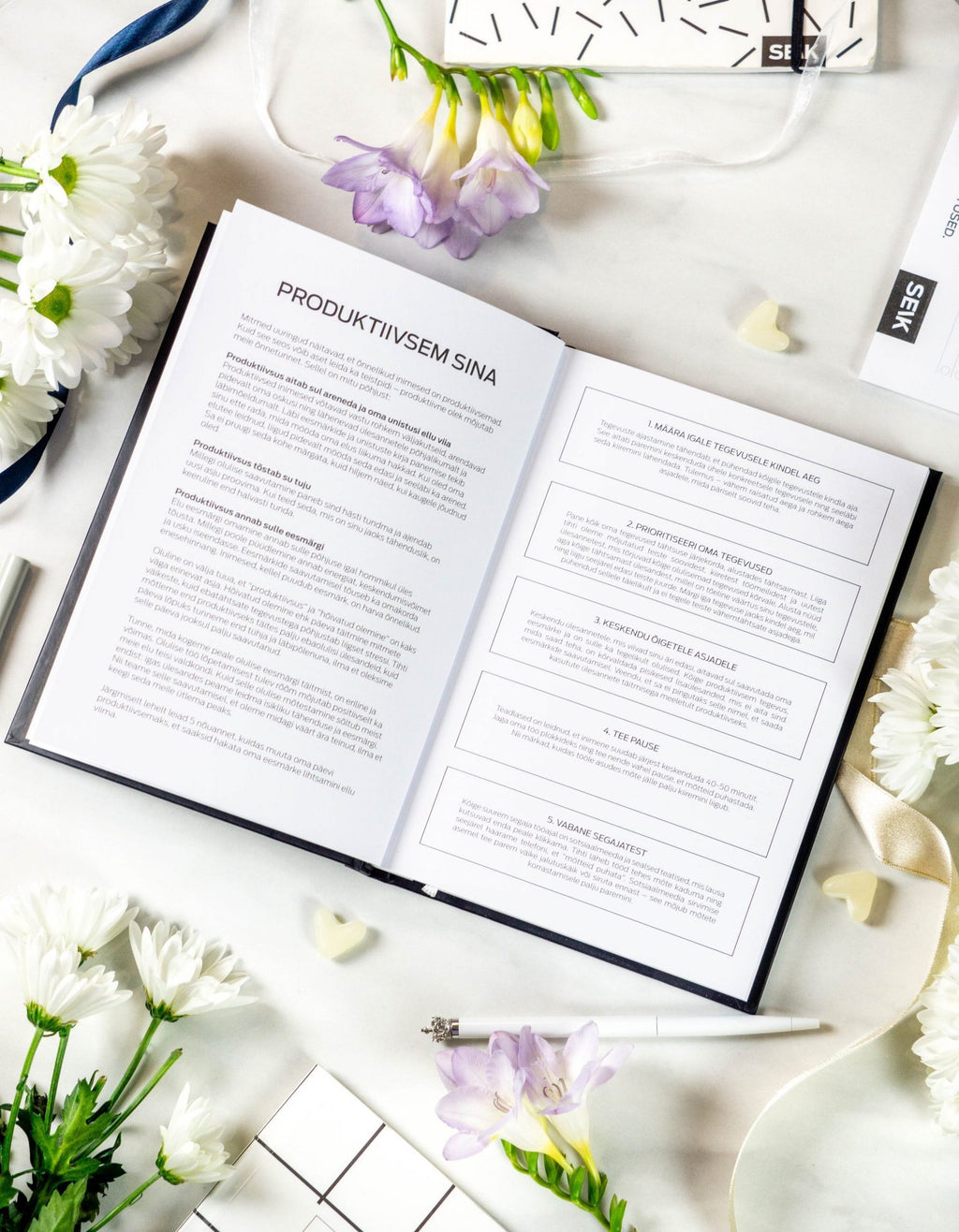 11. Open Get (sh)it done #Produktiivsuspäevik planner showing productivity tips, with floral accents