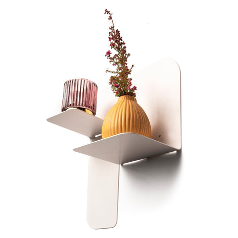 1. White metal floating wall shelf with pink glass and yellow vase, minimalist design