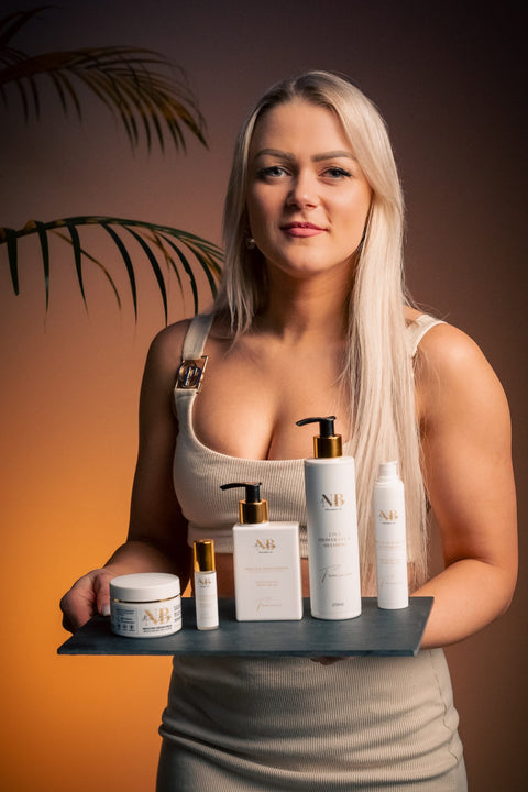 1. Woman holding a tray of North Beauty skincare products, including the Moisturizing Eye Serum, in a lifestyle setting