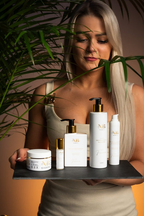 1. Woman holding North Beauty skincare products including Moisturising Body Cream with Aloe Vera and Calendula, lifestyle setting