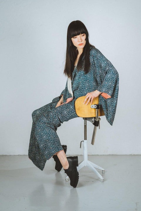 2. Unisex black Samelin Widgets worn by female model in studio setting