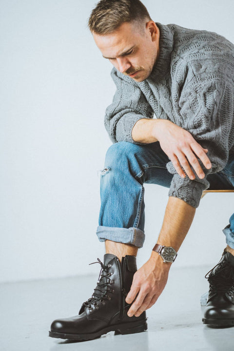 2. Man lacing up Samelin Hawk Pilot Boots, highlighting quick lace-lock system and durable leather