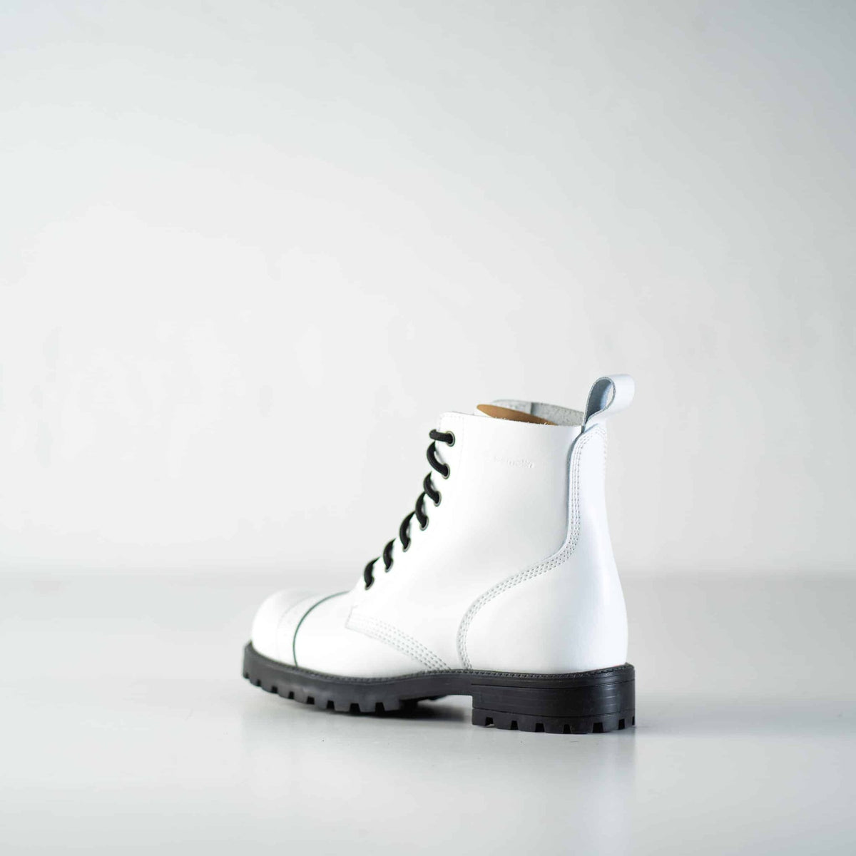 5. Studio image of Samelin 517 Aviator Boots in white, rear view highlighting heel and pull tab
