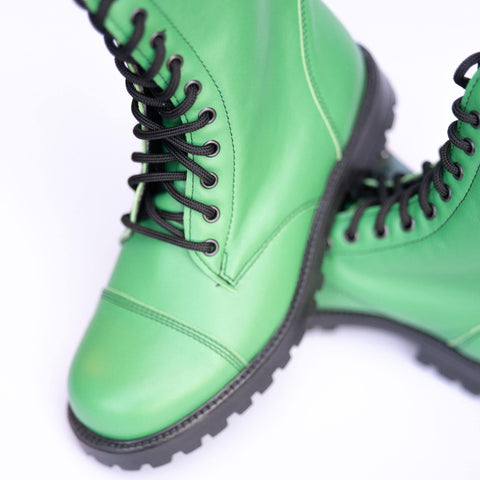 4. Close-up of green leather Samelin 511 Granny Smith boots, highlighting laces and texture