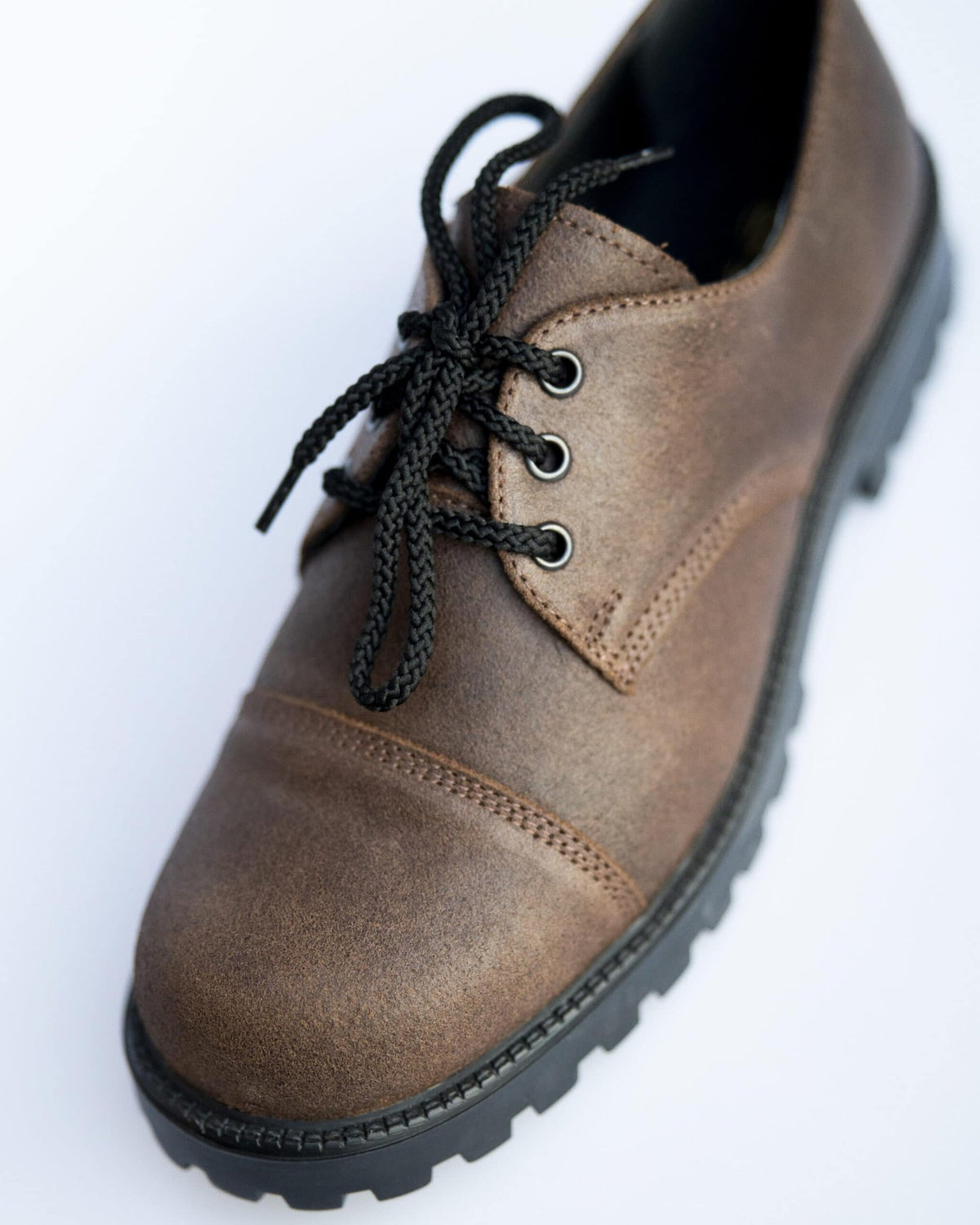 4. Close-up of unisex dark brown Samelin Widgets shoe, showcasing leather texture and black laces