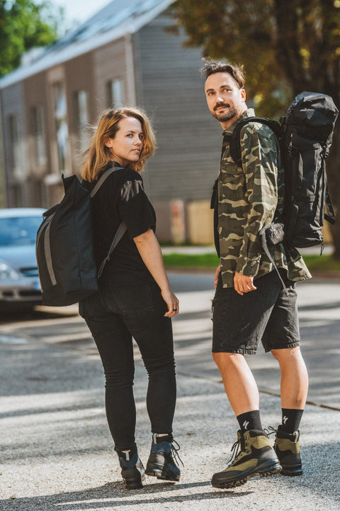 4. Man and woman posing with Matrix Pro Alfa 30 hiking bag in urban setting