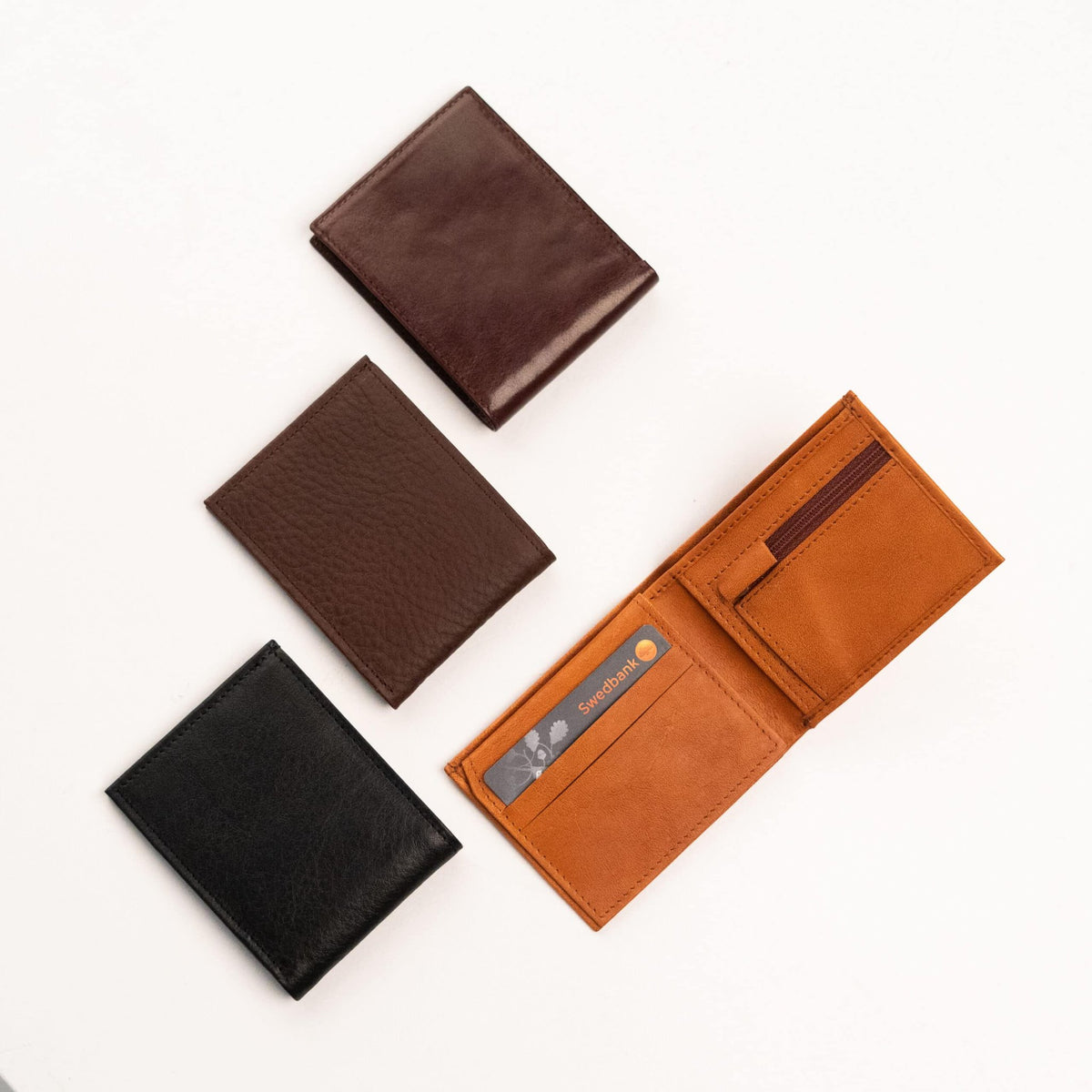 4. Flat lay of Papillon Leather Wallet No. 21 in various colors, showcasing interior and exterior design