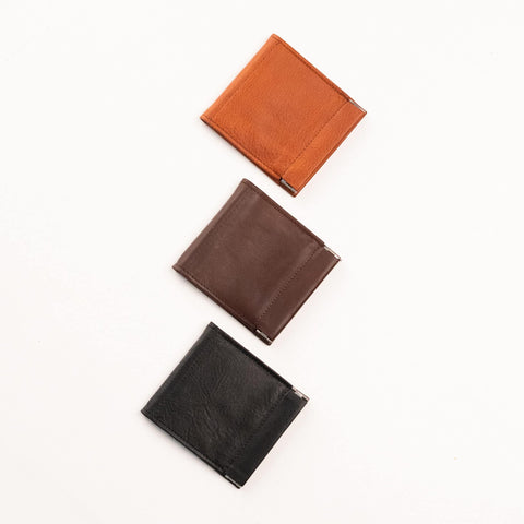 3. Flat lay of Papillon Wallet No. 35 in cognac, dark brown, and black leather, showcasing front design