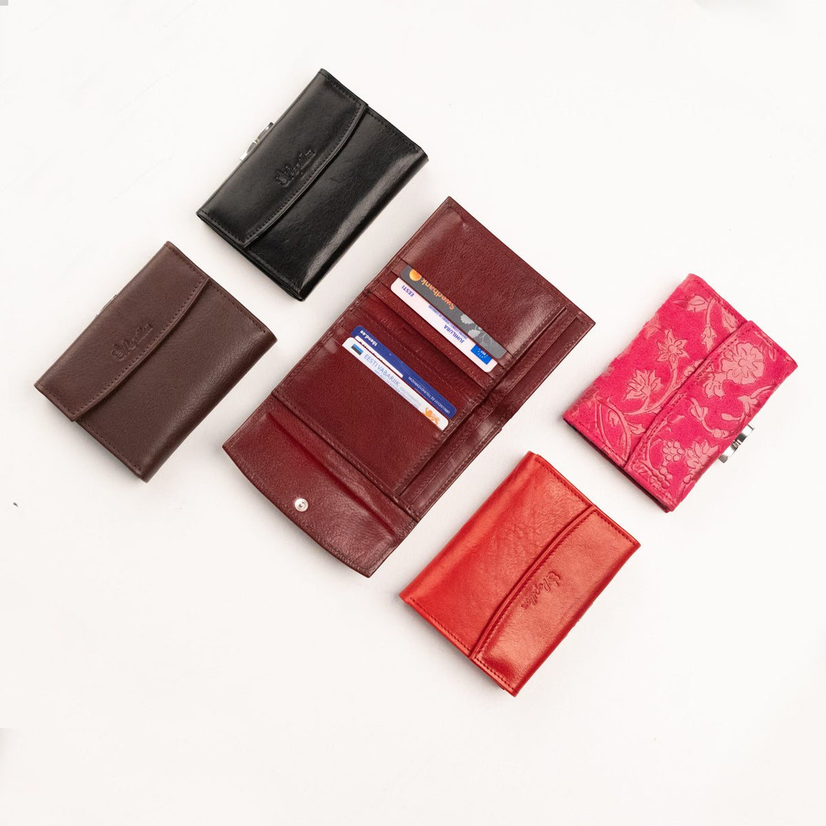 1. Assorted Papillon women's leather wallets in various colors, showcasing compact design and craftsmanship