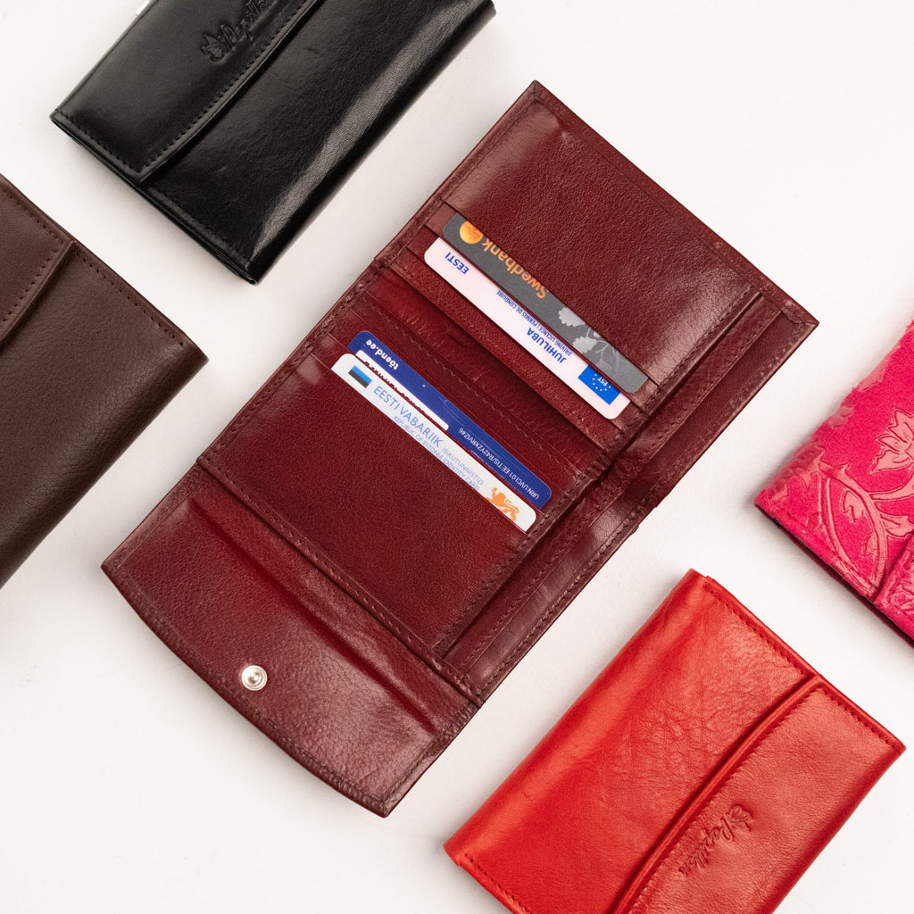 2. Close-up of Papillon women's leather wallets in black, brown, red, and pink, highlighting card slots and design