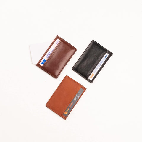 2. Flat lay of Papillon Leather Card Holder No. 34 in dark brown, black, and cognac, displaying compact design and card slots