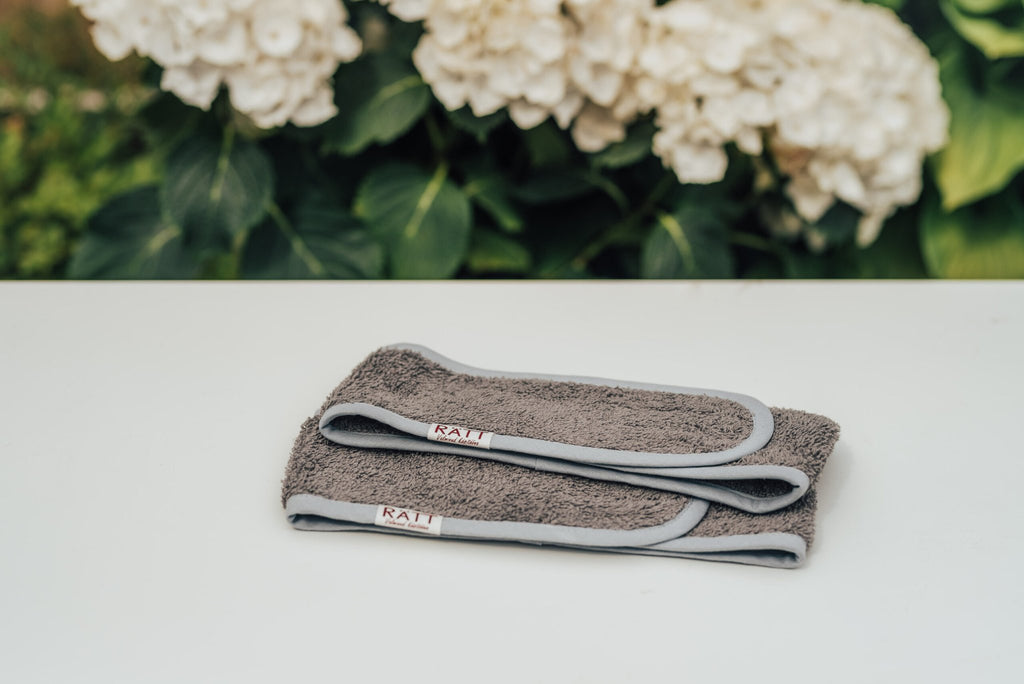 4. Flat lay of two gray RÄTT cotton terry headbands with adjustable velcro closure