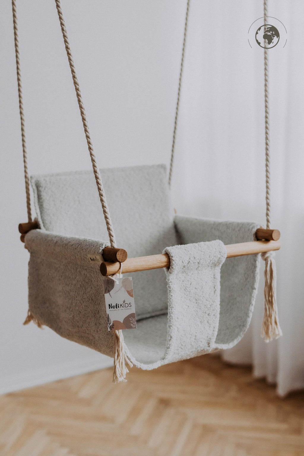 4. Nofi KIDS bouclé ice grey baby swing with oak wood poles hanging indoors