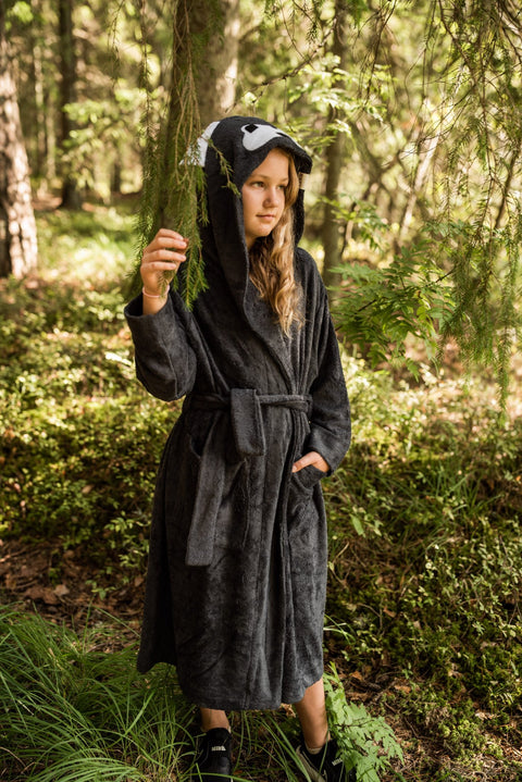 1. Toddler wearing RÄTT WOLF Bamboo Terry Bathrobe with hood in forest setting
