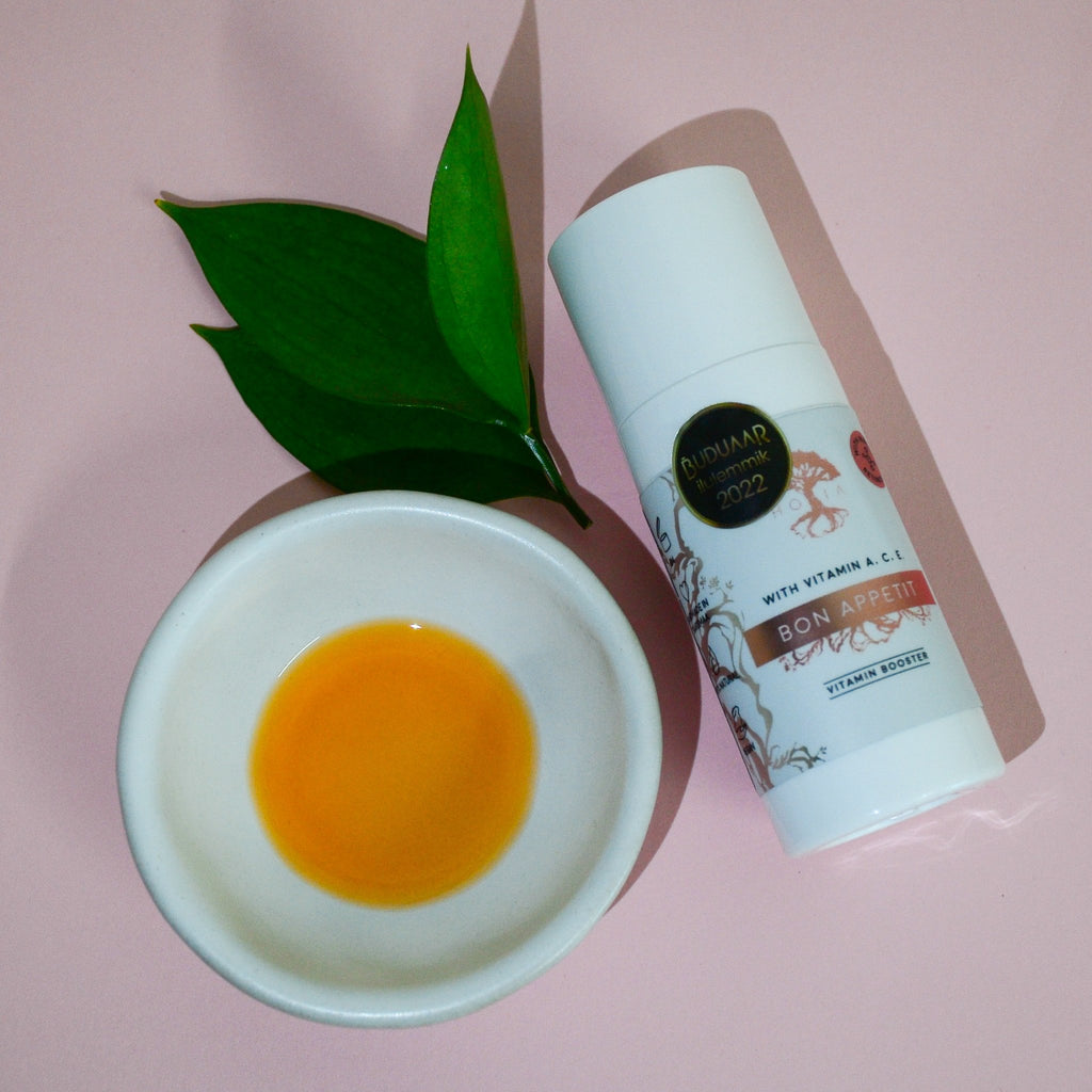 2. HOIA homespa Bakuchiol Vitamin Serum Bon Appetit with green leaves and a bowl of serum, highlighting natural ingredients