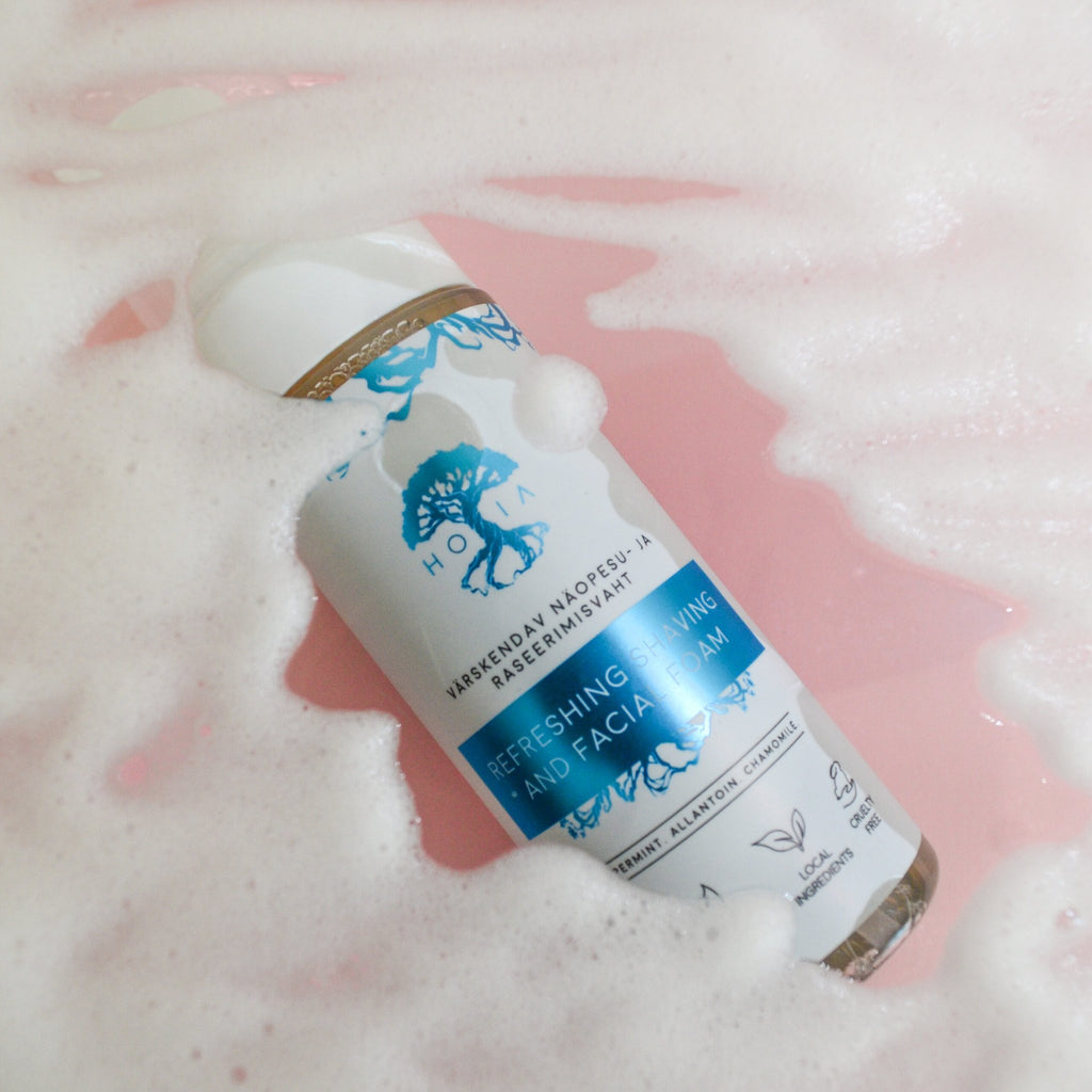 6. HOIA homespa refreshing shaving and facial foam surrounded by foam, highlighting cleansing properties