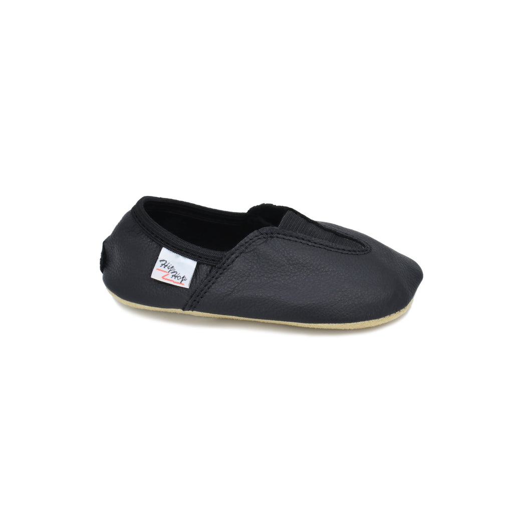 2. Studio image of Hip-Hop Punsa Kids Barefoot Slippers in black, showing side view with elastic band and rubber edge