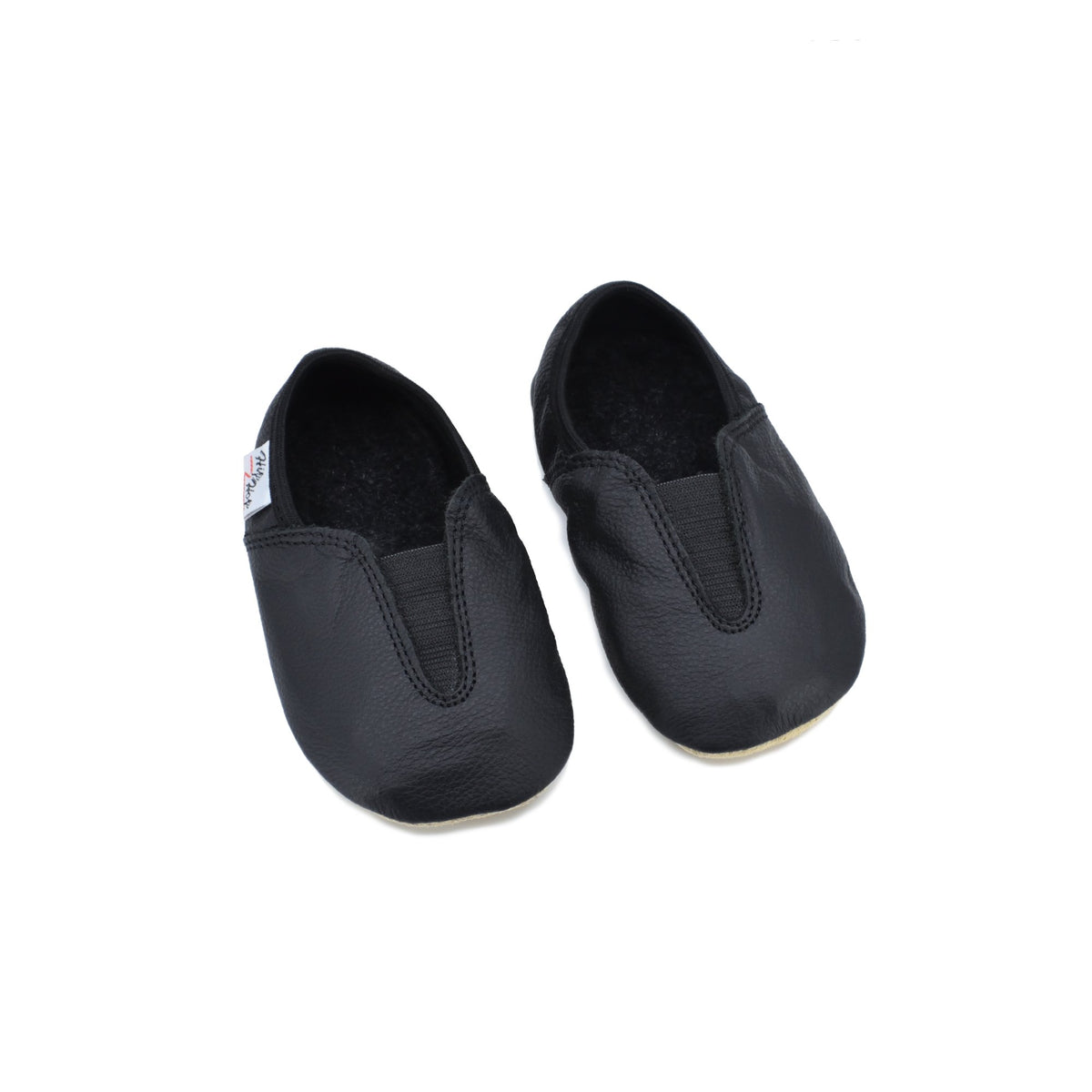 4. Studio image of Hip-Hop Punsa Kids Barefoot Slippers in black, showing pair from top view