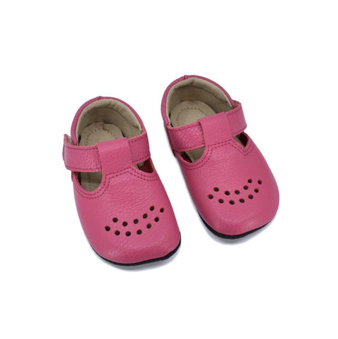 1. Kids' Mutsu slippers in fuchsia by Omaking, featuring extra soft leather upper and adjustable Velcro fastener, shown in studio setting