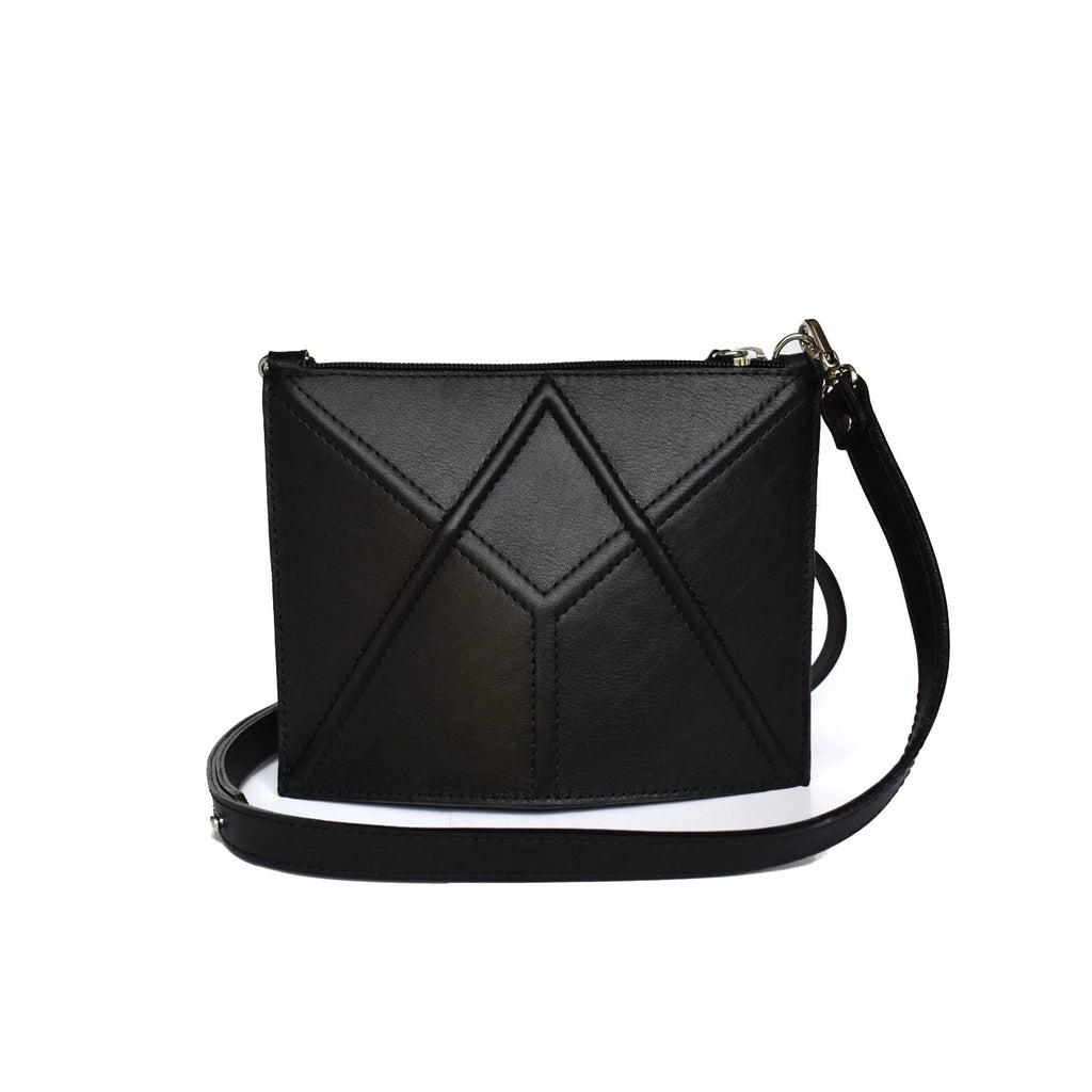 8. Studio shot of black FACET Mini leather bag by Gerda Retter Design with adjustable strap