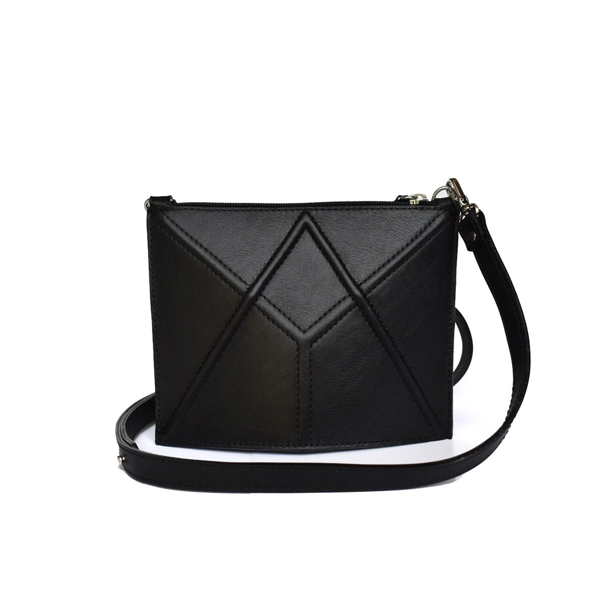 8. Studio shot of black FACET Mini leather bag by Gerda Retter Design with adjustable strap