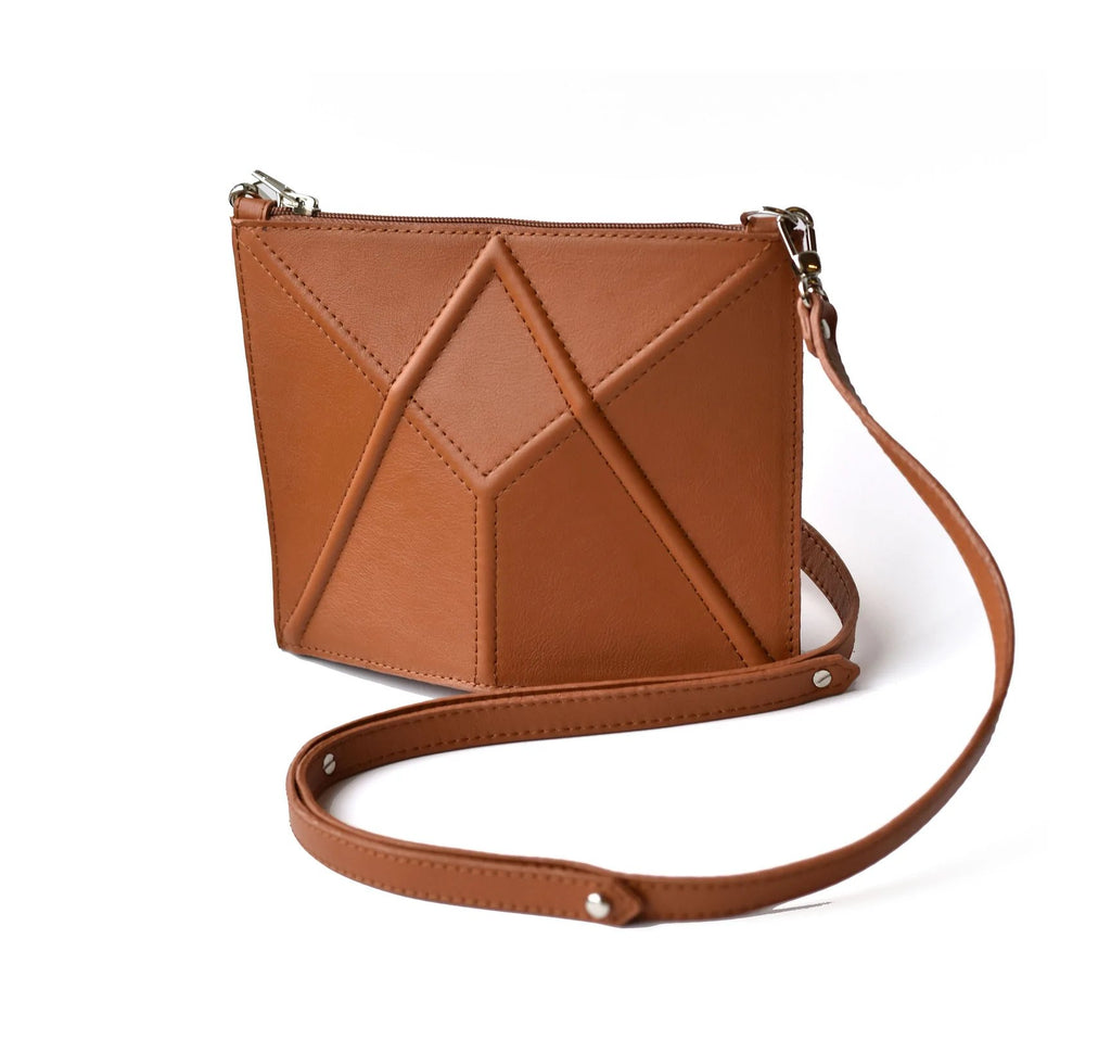 5. Studio shot of brown FACET Mini leather bag by Gerda Retter Design with adjustable strap