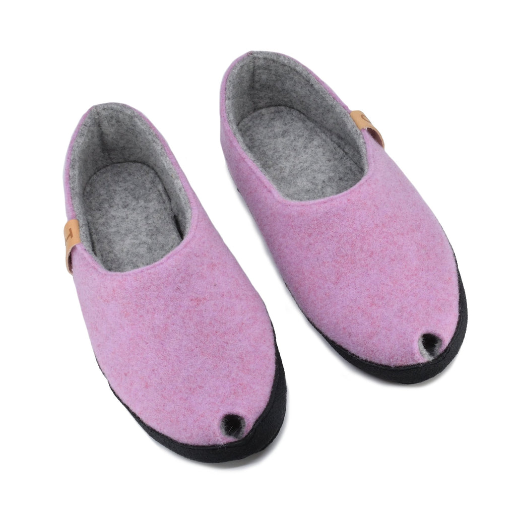 2. Pair of women's TOKU Budapest slippers in light pink, top view highlighting peek-hole design and arch support insole