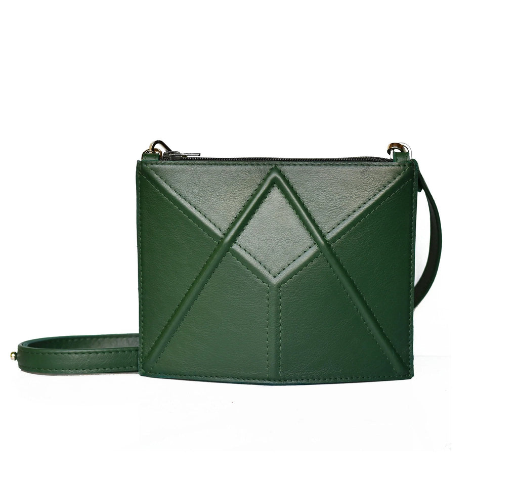 7. Studio shot of dark green FACET Mini leather bag by Gerda Retter Design with adjustable strap