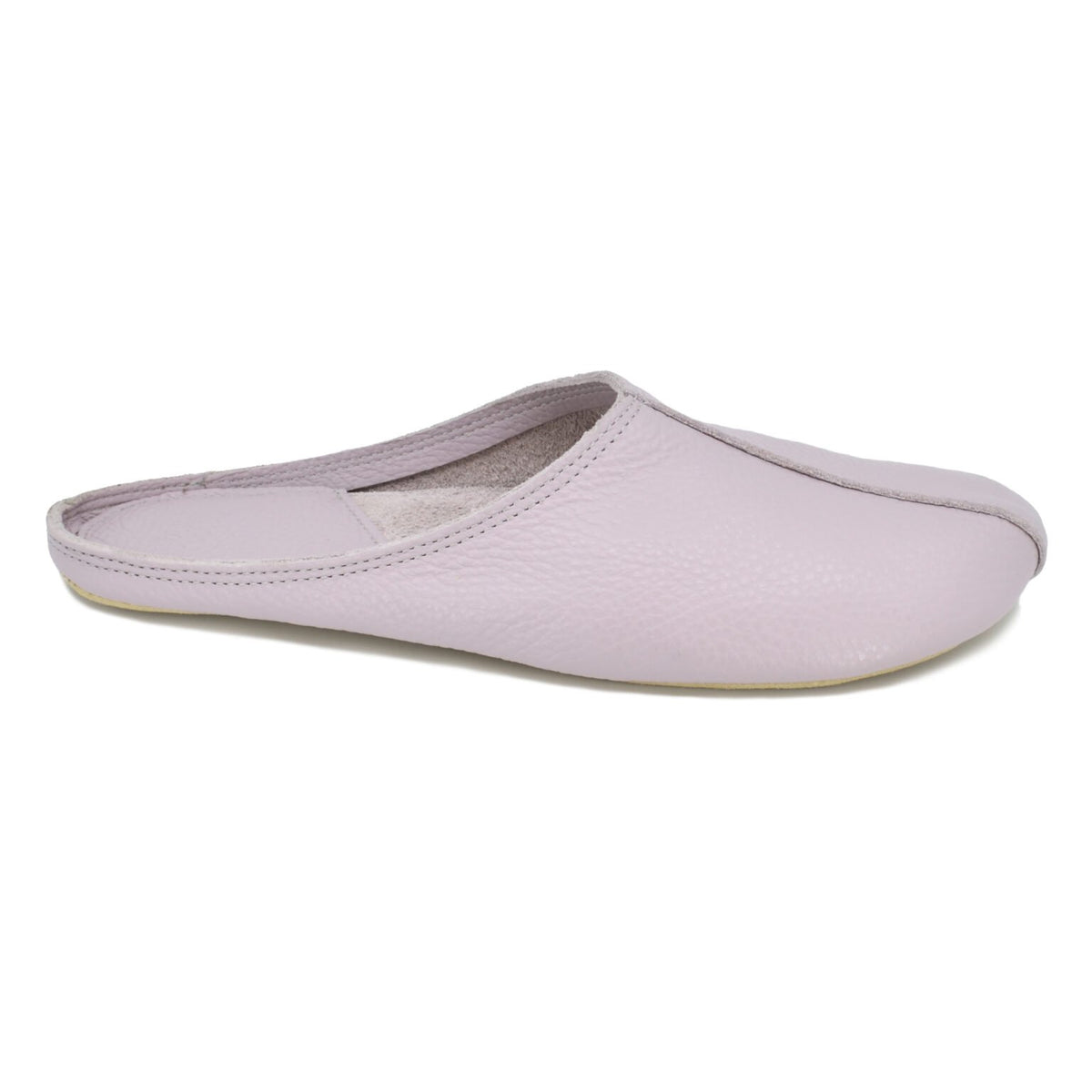 2. Studio side view of Omaking Sulbi Slippers in lilac, highlighting smooth leather upper and wide toe area