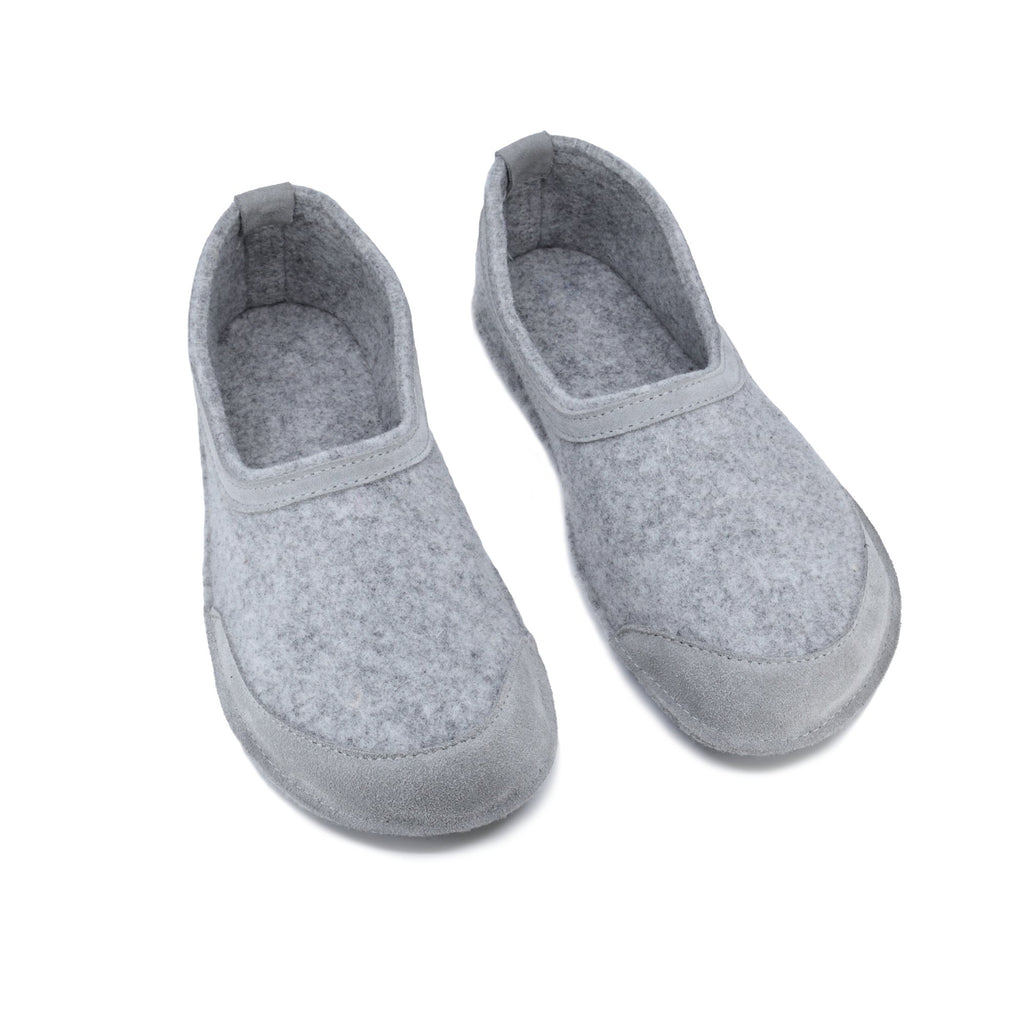 4. Studio image of unisex gray felt barefoot indoor slippers by Omaking with closed toe design