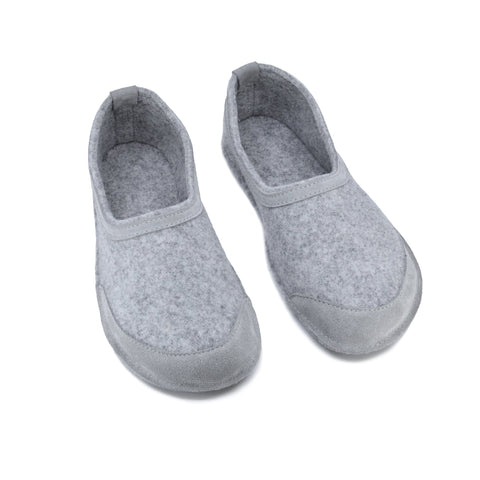 4. Studio image of unisex gray felt barefoot indoor slippers by Omaking with closed toe design