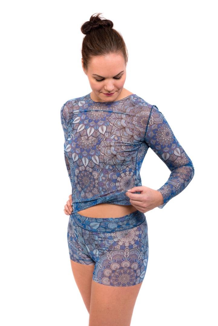 1. Women's tan-through long sleeve shirt in blue mandala pattern by Smarttan, shown in lifestyle setting