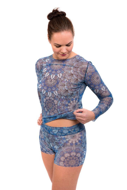 1. Women's tan-through long sleeve shirt in blue mandala pattern by Smarttan, shown in lifestyle setting