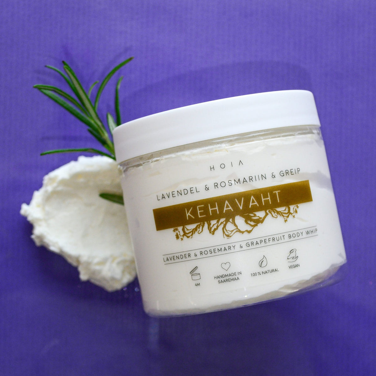 1. HOIA homespa Whipped Body Butter in lavender, grapefruit, and rosemary, shown with rosemary sprig on purple background