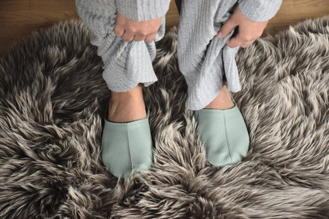 1. Women's mint Sulbi slippers by Omaking worn on a furry rug, showcasing comfort and style