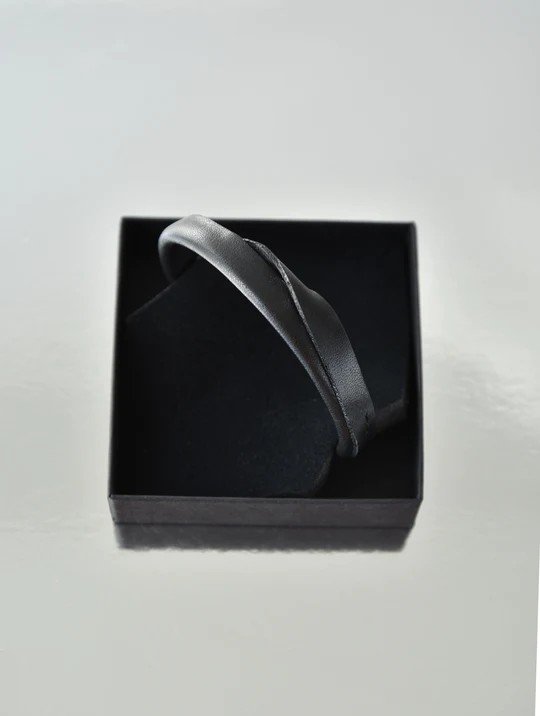 3. Black handmade leather bracelet by Gerda Retter Design in a box, showcasing minimalist Nordic design