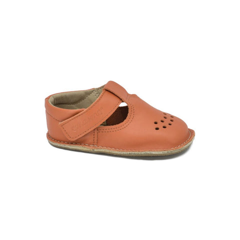 2. Side view of Omaking Lusti orange leather kids' shoe with adjustable Velcro strap and non-slip sole