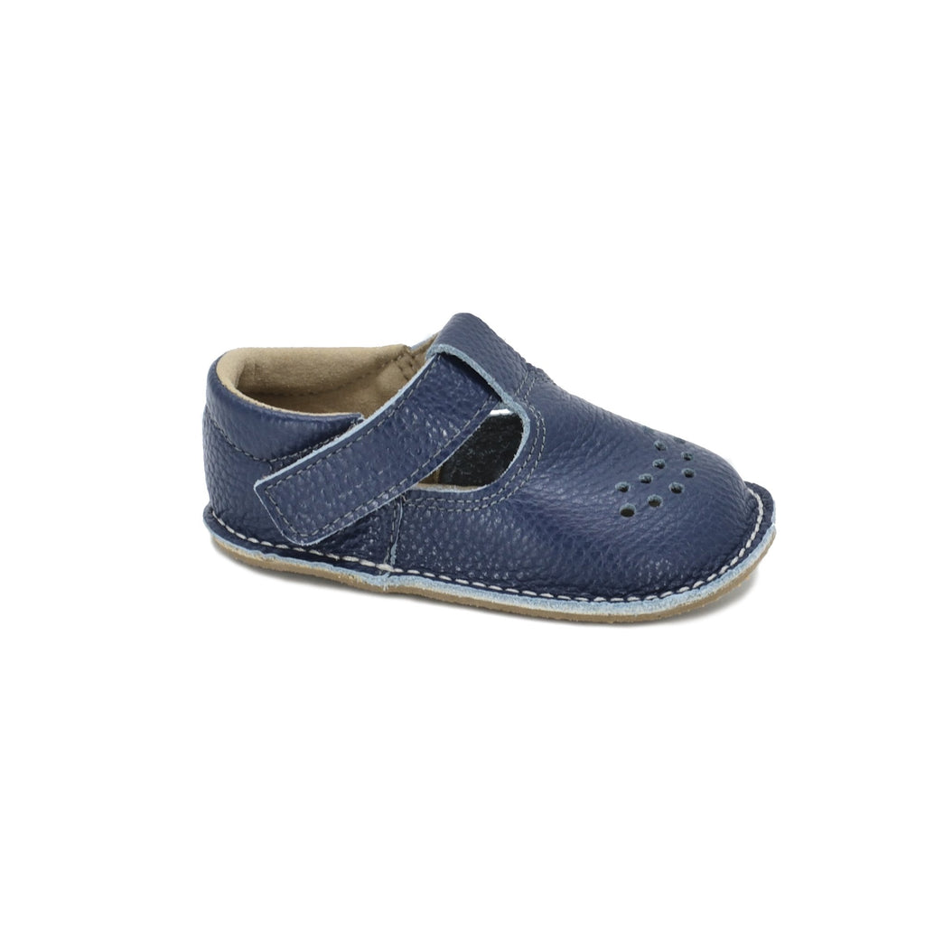 3. Side view of Omaking Lusti dark blue leather kids' shoe with adjustable Velcro fastener