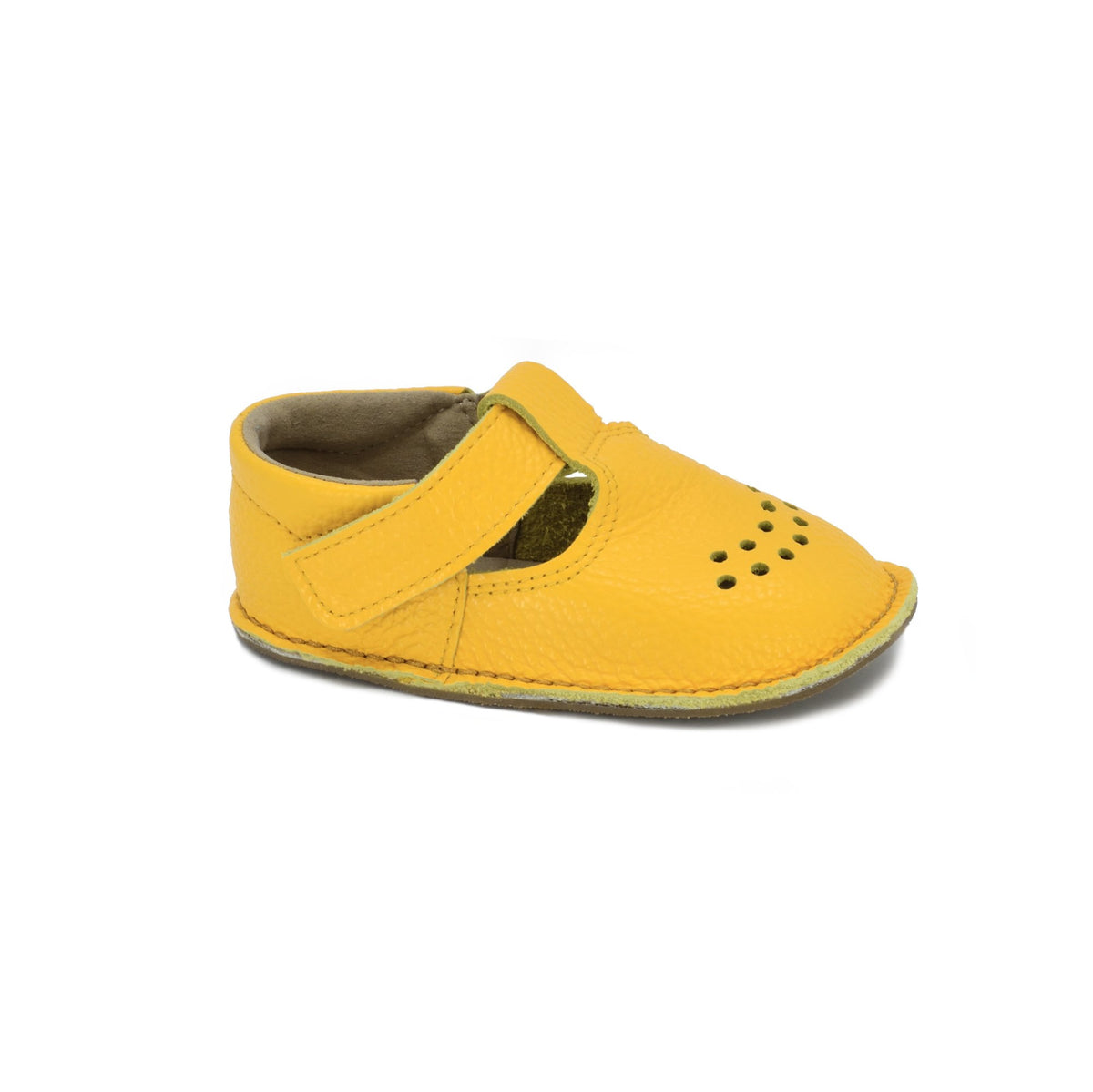 1. Single yellow Lusti leather kids' shoe by Omaking with Velcro fastener and air holes, shown in studio