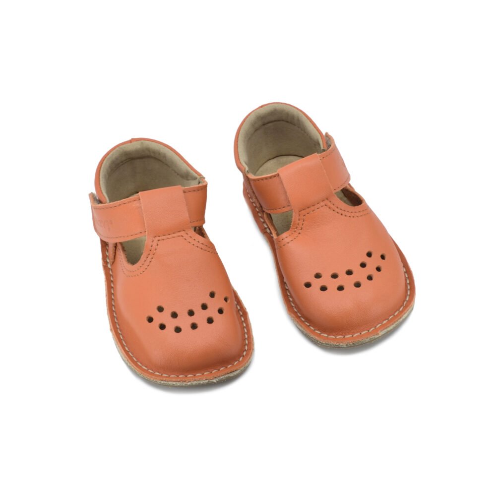 1. Omaking Lusti orange leather kids' shoes with air holes and Velcro fastener, shown in studio