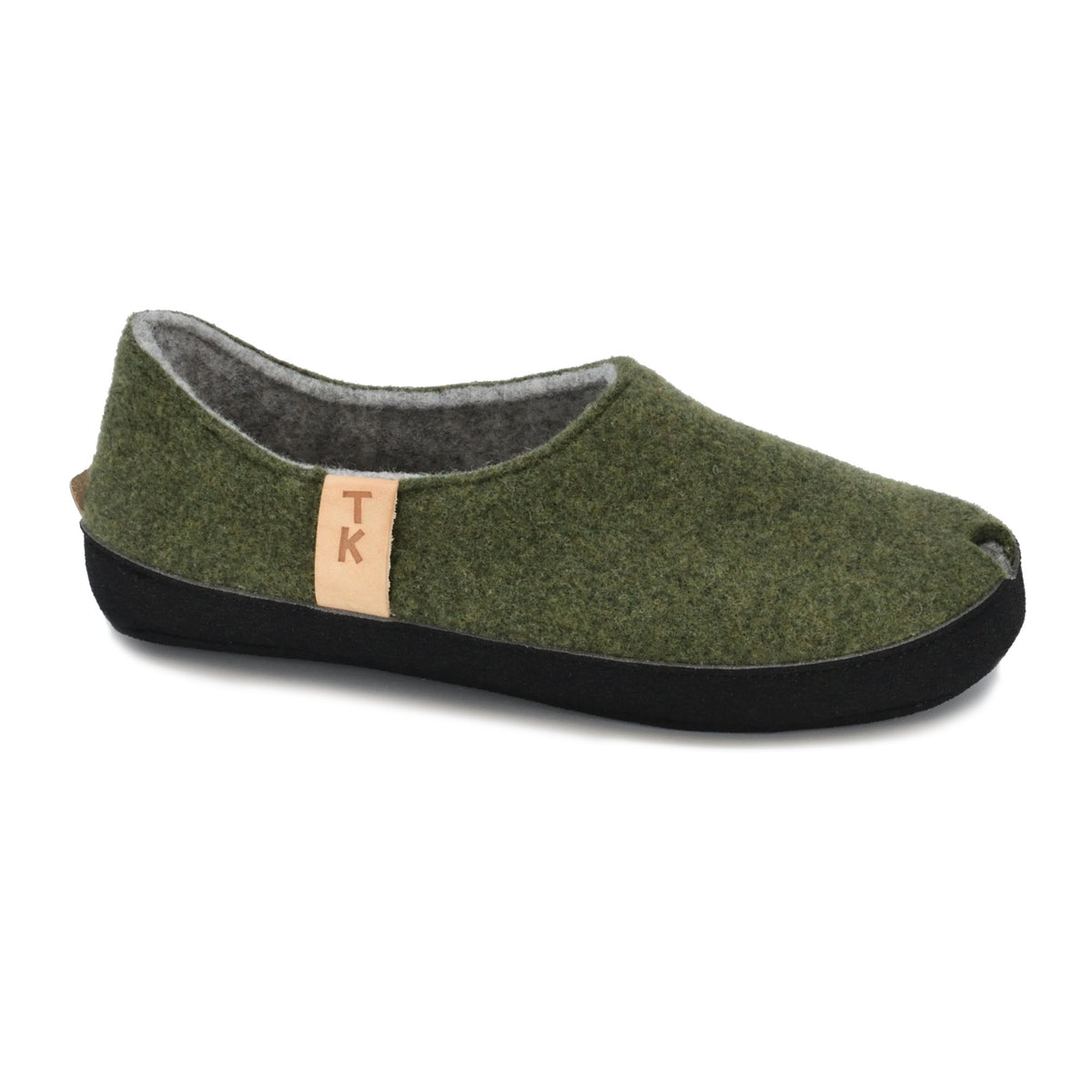 1. Omaking TOKU Budapest slippers in moss green, side view showing closed heel and toe design, made from natural lambswool felt