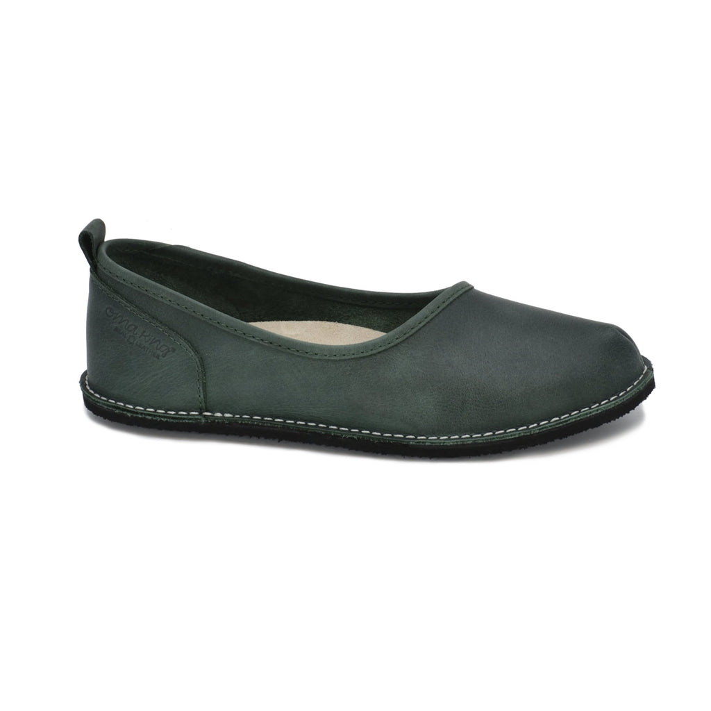 7. Side view of Omaking Kuutsid dark green shoe, highlighting genuine leather upper and EVA rubber outsole