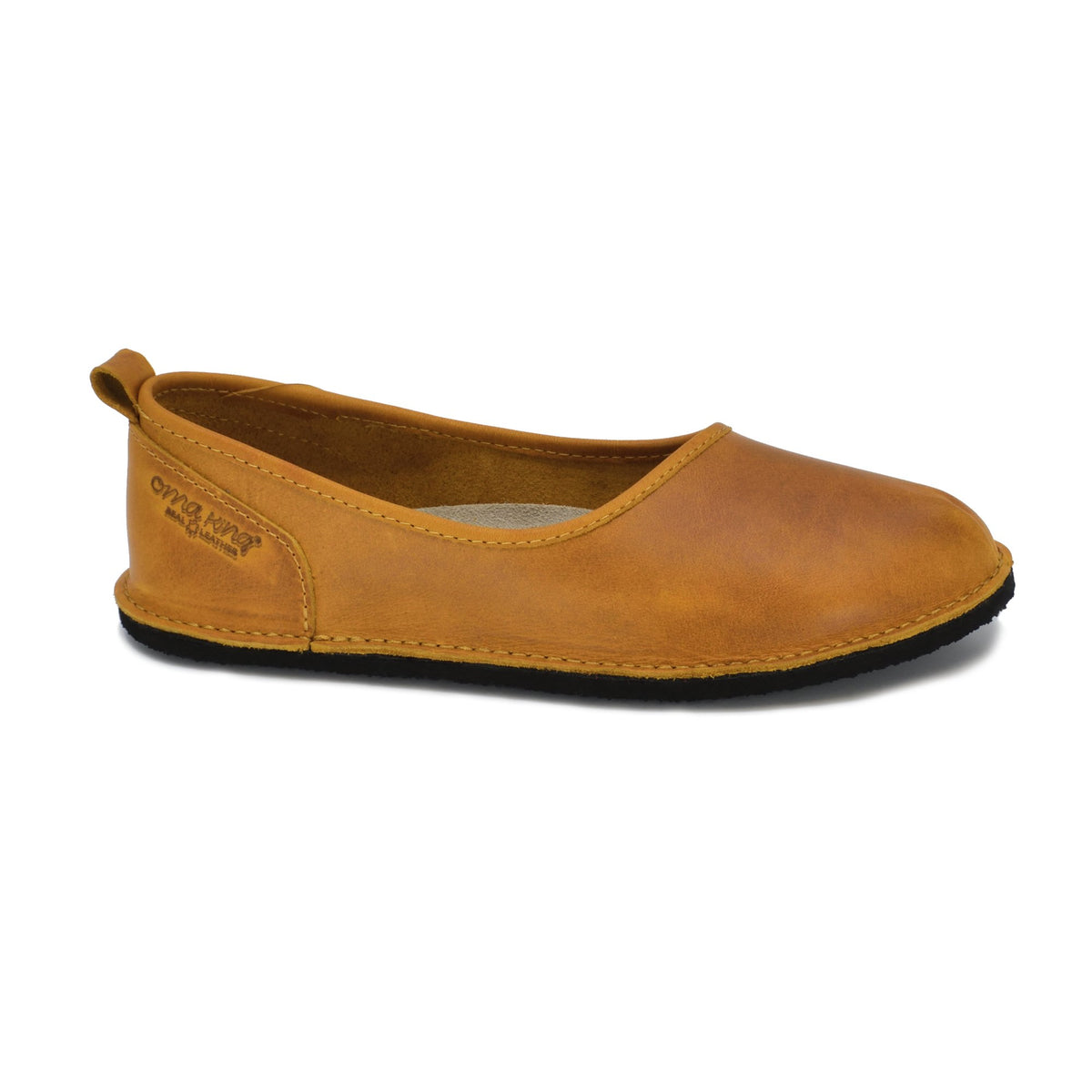 4. Side view of Omaking Kuutsid yellow leather shoe highlighting brand logo and classic design