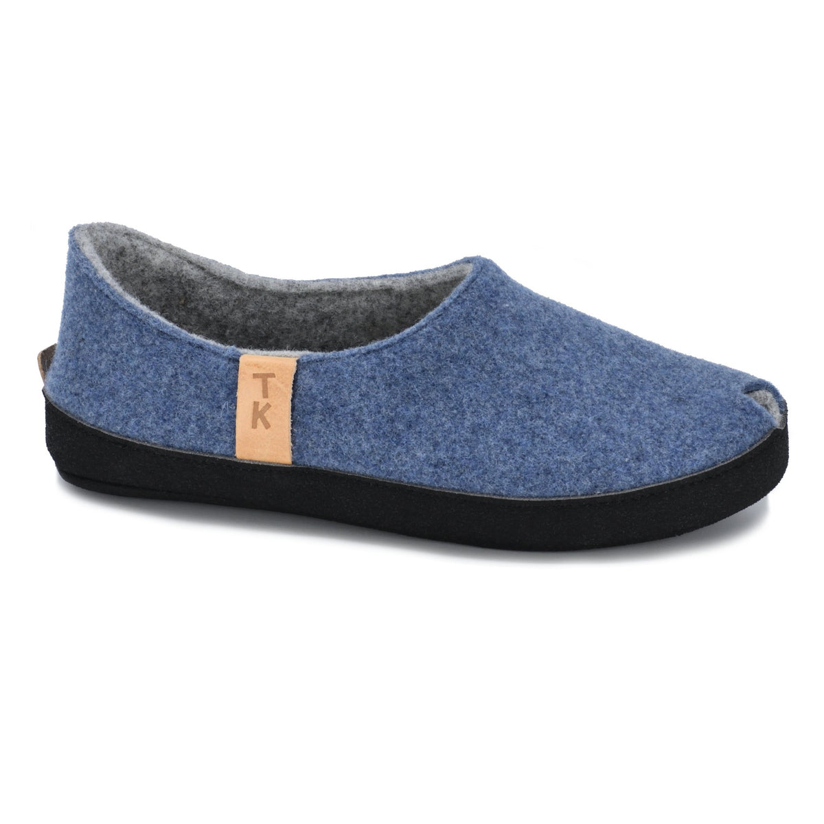 2. Side view of Omaking TOKU Budapest blue slippers with natural lambswool felt and TK branding, shown in studio