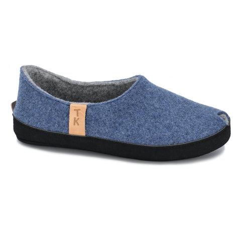 2. Side view of Omaking TOKU Budapest blue slippers with natural lambswool felt and TK branding, shown in studio