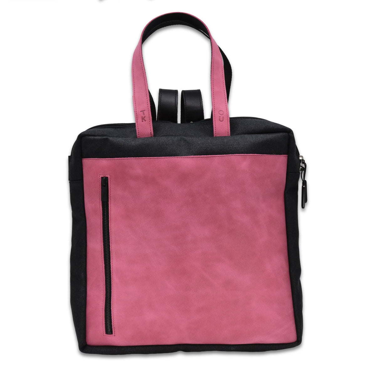 2. Studio image of the Omaking Stockholm Backpack in pink, highlighting the front pocket and leather handles