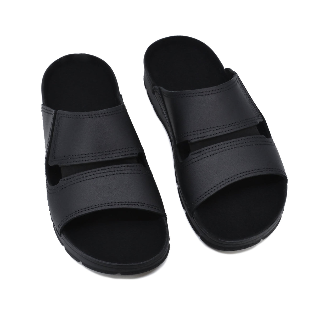 5. Pair of black Miku sandals by Omaking shown from above in studio setting