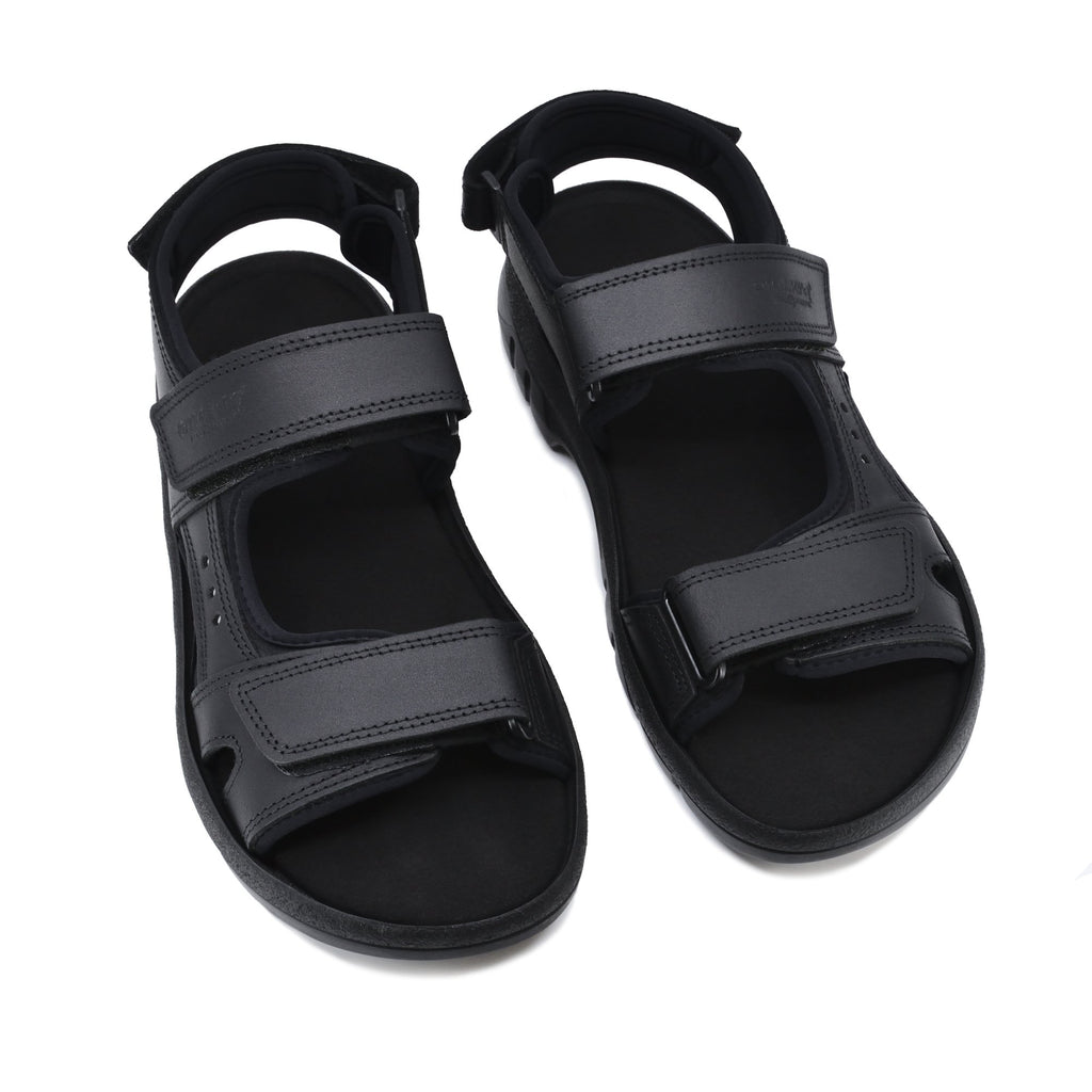 5. Studio shot of Omaking Lauri Leather Sandals in black, showing three adjustable velcro straps and durable sole
