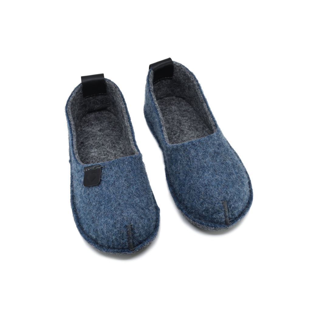 2. Pair of Öko-Toku children's blue slippers, crafted from recycled materials, displayed in studio setting